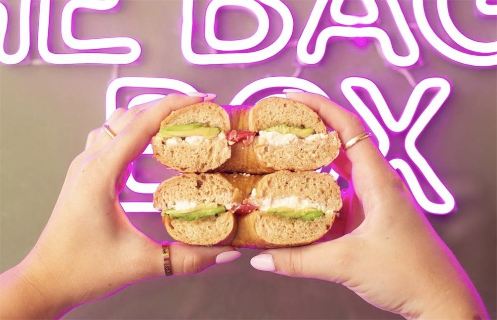 A Fresh Fix bagel held up in the shop